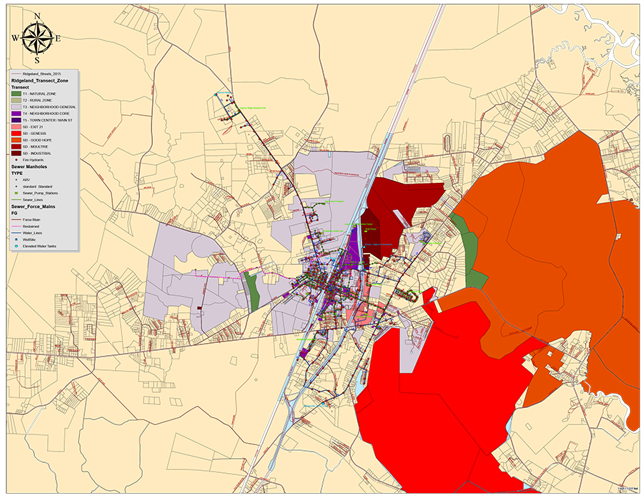 Town of Ridgeland GIS map overlaying transect zoning districts with municipal utilities infrastructure. Color-coded zones include T1 Natural Zone, T2 Rural Zone, T3 Neighborhood General, T4 Neighborhood Core, T5 Town Center and Main Street, SD Exit 21, SD Genesis, SD Good Hope, SD Moultrie, and SD Industrial. Utility features shown include sewer manholes, sewer pump stations, sewer lines, sewer force mains, reclaimed water lines, water lines, fire hydrants, wells, and elevated water tanks. A north arrow compass is displayed in the upper left. Base data sourced from Ridgeland Streets 2015.